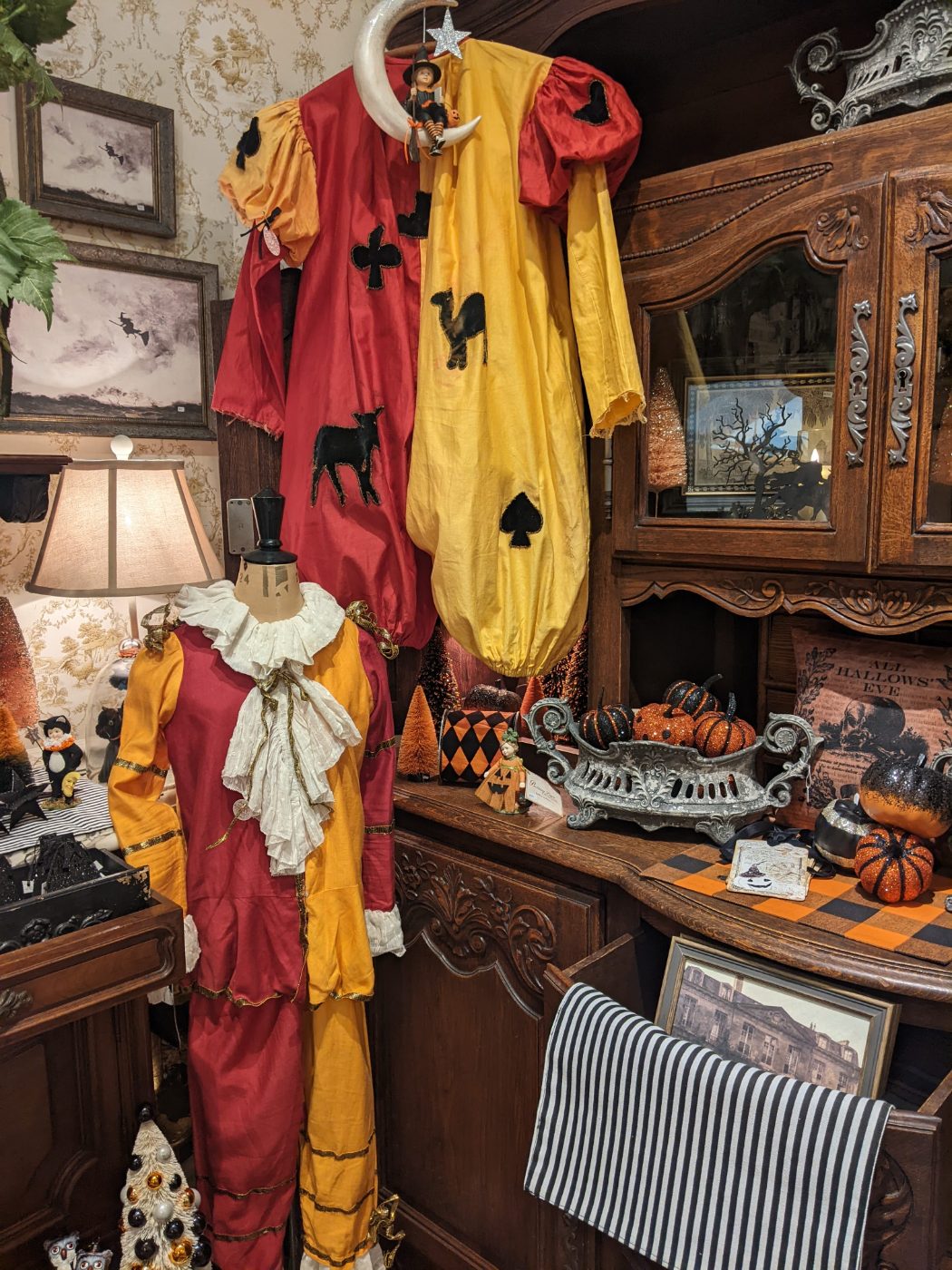 Vintage Halloween merchandise — antique costumes, glitter pumpkins and All Hallows' Eve décor