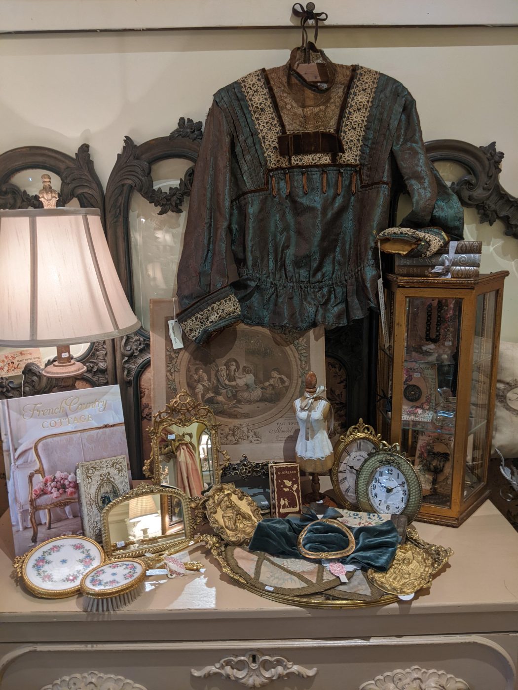 Antique silk bodice, gilded mirrors, and Paris flea market finds located in Plymouth, MI