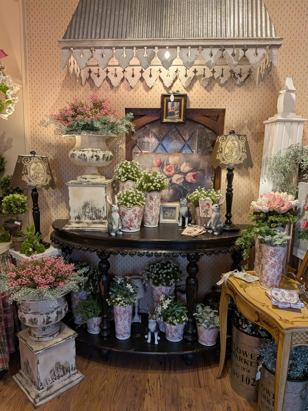 Spring floral arrangements in antique urns
